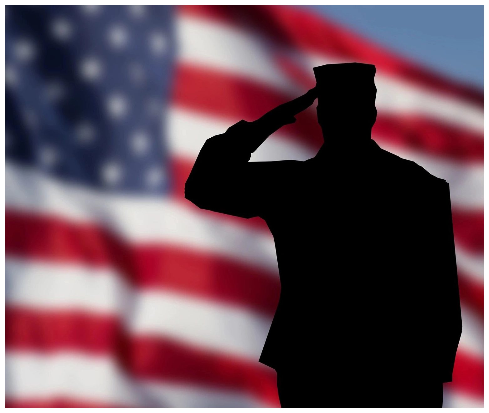 A soldier saluting in front of an american flag.